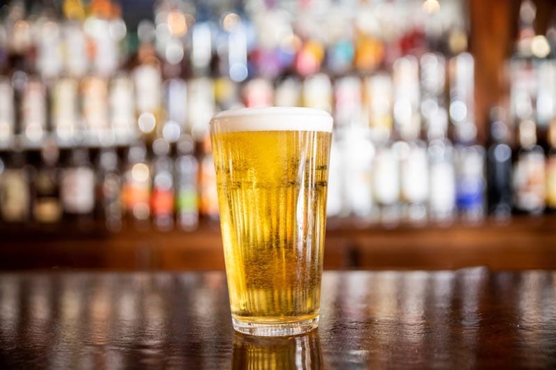 pilsner beer in a glass on bar sports bar restaurant waltham ma